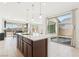 Bright, open kitchen with a large island, white countertops, and stainless steel appliances at 2255 Woodbluff Ave, North Las Vegas, NV 89086