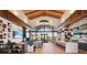 Community clubhouse with luxury lounge featuring TVs, modern décor, and a grand marble island with barstool seating at 2255 Woodbluff Ave, North Las Vegas, NV 89086