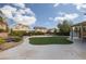 Enjoy outdoor living with a spacious patio, turf area, and gazebo, perfect for gatherings and relaxation at 23 Crescent Palm Ct, Henderson, NV 89002