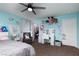 This secondary bedroom offers a ceiling fan, and door to a walk-in closet, for storage and comfort at 23 Crescent Palm Ct, Henderson, NV 89002