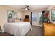 Comfortable bedroom featuring large windows, ceiling fan, and ample space for relaxation at 23 Crescent Palm Ct, Henderson, NV 89002