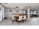 Open-concept dining room featuring hardwood floors, modern lighting, and comfortable seating at 23 Crescent Palm Ct, Henderson, NV 89002