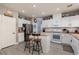 Bright and airy kitchen featuring an island with seating and stainless steel appliances at 23 Crescent Palm Ct, Henderson, NV 89002