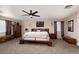 Warm, inviting bedroom with neutral tones, king sized bed and ceiling fan at 23 Crescent Palm Ct, Henderson, NV 89002