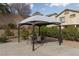 Outdoor patio featuring a gazebo with a table and chairs for outdoor dining at 23 Crescent Palm Ct, Henderson, NV 89002