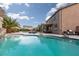 Backyard pool area with patio, grill and lounge chairs, perfect for outdoor entertaining at 23 Crescent Palm Ct, Henderson, NV 89002