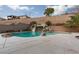 Inviting swimming pool with a rock slide feature offering a fun backyard oasis at 23 Crescent Palm Ct, Henderson, NV 89002