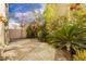 Private backyard oasis with stone patio and lush landscaping, perfect for outdoor entertaining at 2345 Cliffwood Dr, Henderson, NV 89074