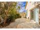 Private backyard oasis with stone patio and lush landscaping, perfect for outdoor entertaining at 2345 Cliffwood Dr, Henderson, NV 89074