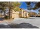 Charming two-story home featuring a well-manicured yard, tile roof, and a two-car garage at 2345 Cliffwood Dr, Henderson, NV 89074