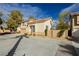 Charming two-story home featuring a well-manicured front yard, tile roof, and a two-car garage at 2345 Cliffwood Dr, Henderson, NV 89074