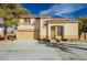 Charming two-story home featuring a well-manicured front yard, tile roof, and a two-car garage at 2345 Cliffwood Dr, Henderson, NV 89074