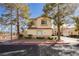 Charming two-story home featuring a well-manicured front yard, tile roof, and a two-car garage at 2345 Cliffwood Dr, Henderson, NV 89074