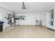 Clean garage with organized storage, including shelves and bicycle racks, and a water heater on the back wall at 2345 Cliffwood Dr, Henderson, NV 89074