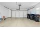 Spacious two car garage with an automatic door opener and trash and recycle bins at 2345 Cliffwood Dr, Henderson, NV 89074