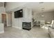 Living room featuring a fireplace and is open to the kitchen and dining area at 2345 Cliffwood Dr, Henderson, NV 89074