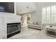 Bright living room with fireplace, plantation shutters and access to outdoor space at 2345 Cliffwood Dr, Henderson, NV 89074