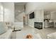 Living room featuring fireplace, high ceilings, staircase and adjoins the kitchen at 2345 Cliffwood Dr, Henderson, NV 89074