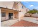 A covered patio extends from the backyard, which is fenced and features gravel landscaping at 2407 Belt Buckley Dr, Henderson, NV 89002