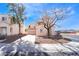 Two-story home features a tile roof, attached garage, and low-maintenance landscaping at 2407 Belt Buckley Dr, Henderson, NV 89002