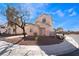 Two-story home features a tile roof, simple landscaping, and a sidewalk at 2407 Belt Buckley Dr, Henderson, NV 89002