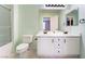 Bathroom featuring a double sink vanity with a tile floor and shower with glass doors at 25 Lone Cove Ct # 2, Henderson, NV 89012