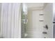 Close-up of a bathtub with a clear glass shower door and tiled walls in the bathroom at 25 Lone Cove Ct # 2, Henderson, NV 89012