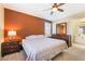 Comfortable bedroom with a ceiling fan, dresser and a comfortable bed with pillows at 25 Lone Cove Ct # 2, Henderson, NV 89012