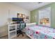 Bedroom featuring a bed, desk with monitors, a window with blinds and a ceiling fan at 25 Lone Cove Ct # 2, Henderson, NV 89012