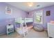 bedroom with natural light, bunkbeds, and purple walls at 25 Lone Cove Ct # 2, Henderson, NV 89012