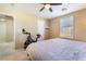 Bedroom featuring a ceiling fan, window with shutters and a bed with patterned bedding at 25 Lone Cove Ct # 2, Henderson, NV 89012
