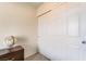 Bedroom features closet with sliding doors; globe on dresser adds character at 25 Lone Cove Ct # 2, Henderson, NV 89012