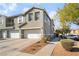 Exterior view of townhome with attached garage and neutral color scheme at 25 Lone Cove Ct # 2, Henderson, NV 89012