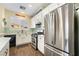 Well-lit kitchen features white cabinets, stainless steel appliances, and a window at 25 Lone Cove Ct # 2, Henderson, NV 89012
