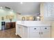 Bright and airy kitchen with white cabinets, wood look floors, and an open layout at 25 Lone Cove Ct # 2, Henderson, NV 89012