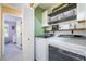 Convenient laundry room with modern washer and dryer, shelving, and storage at 25 Lone Cove Ct # 2, Henderson, NV 89012