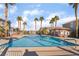 Community pool with palm trees and lounge area at 25 Lone Cove Ct # 2, Henderson, NV 89012