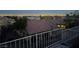 Serene backyard view showcasing a tidy landscape with a skyline backdrop at dusk at 2536 Faiss Dr, Las Vegas, NV 89134