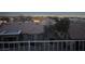 Backyard view features desert landscaping, tiled roofs, and a captivating city view beyond at 2536 Faiss Dr, Las Vegas, NV 89134