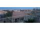 Backyard offering panoramic city views, privacy fencing, desert landscaping, and neighborhood rooftops at 2536 Faiss Dr, Las Vegas, NV 89134