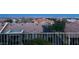 Charming backyard view with tiled rooftops and a beautiful panoramic cityscape in the background at 2536 Faiss Dr, Las Vegas, NV 89134