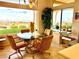 Dining room with a glass table, comfortable chairs, and scenic views at 2536 Faiss Dr, Las Vegas, NV 89134