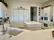 Bright kitchen with a central island, white cabinetry, and modern appliances at 2536 Faiss Dr, Las Vegas, NV 89134