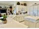 Modern kitchen with white cabinets, quartz countertops, and stainless steel appliances at 2536 Faiss Dr, Las Vegas, NV 89134