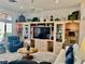 Living room featuring a large entertainment center and comfortable seating at 2536 Faiss Dr, Las Vegas, NV 89134