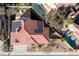 A beautiful aerial view of a home with a red tiled roof, solar panels, and a large well maintained yard at 2637 Ohio Ct, Las Vegas, NV 89128
