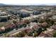 Community aerial view showcasing homes with desert landscaping with city views at 2637 Ohio Ct, Las Vegas, NV 89128
