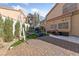 This backyard offers a basketball court, ample patio space and privacy landscaping at 2637 Ohio Ct, Las Vegas, NV 89128