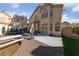 Spacious backyard features a brick patio, basketball hoop, and manicured landscaping for outdoor enjoyment at 2637 Ohio Ct, Las Vegas, NV 89128