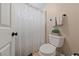 Cozy bathroom with a toilet, shower curtain, and towel rack for a simple, functional design at 2637 Ohio Ct, Las Vegas, NV 89128